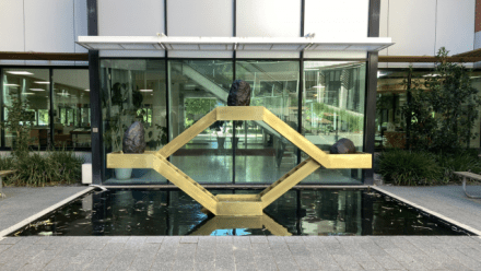 Kensuke Todo, Utsuroi 移ろい (transience), 2025 (installation view, ANU Hancock Library courtyard), brass, cast bronze, stainless steel. Australian National University Art Collection, commissioned 2025.