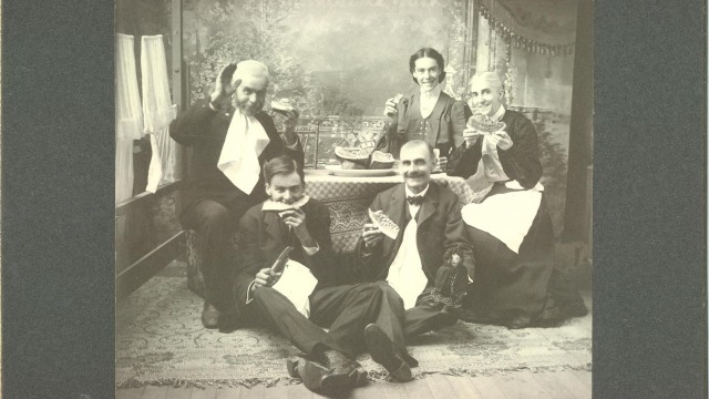 Tanya Sheehan Studio portrait - white family with melon. CA 1900
