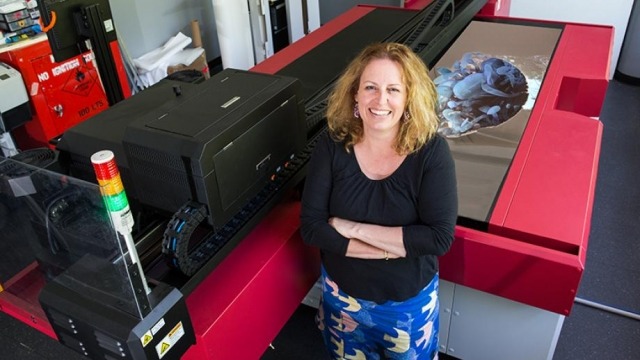 Erica Seccombe wins $20k Paramor art prize Erica Seccombe with the new Anapurna inkjet printer and her work Virtual Life. Image: Stuart Hay
